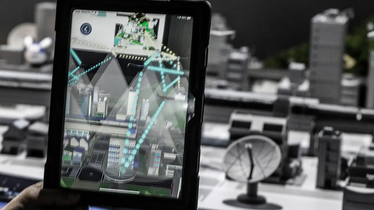 Technology exhibit of "3D space communication network connecting space, air, sea, and ground" that combines diorama and AR to "visualize" communications