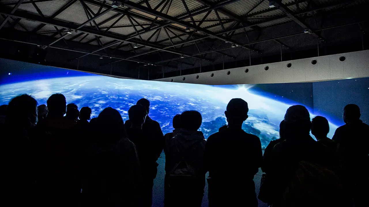 Prologue Theater" in ZONE 1 of the Beyond 5G ready showcase, featuring a dynamic representation of the history of telecommunications on a 180-degree screen.